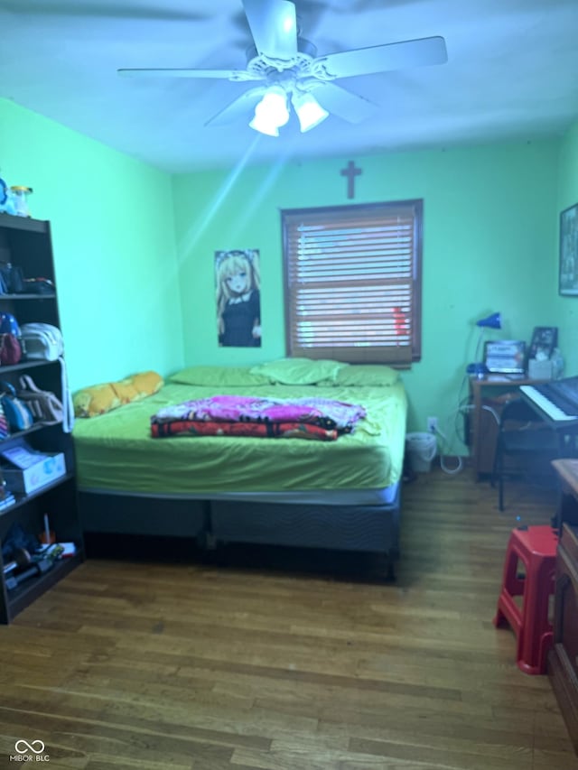 bedroom featuring ceiling fan and wood finished floors