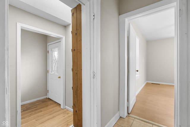 5713 Bluff Rd, Indianapolis, IN 46217 - hallway with baseboards and light wood-style floors