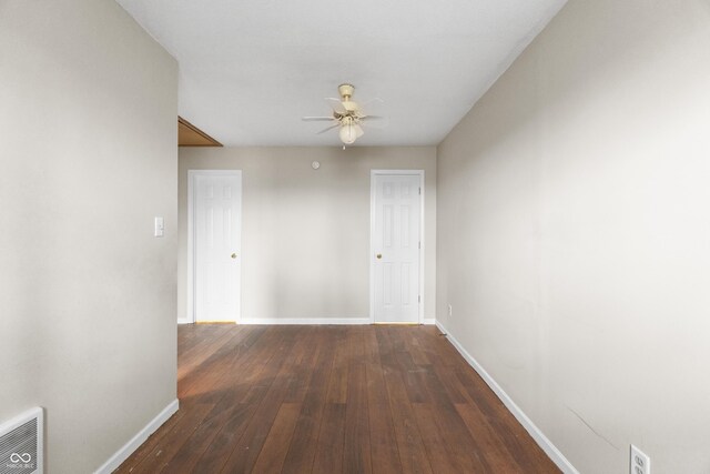 5713 Bluff Rd, Indianapolis, IN 46217 - hall with wood-type flooring, visible vents, and baseboards