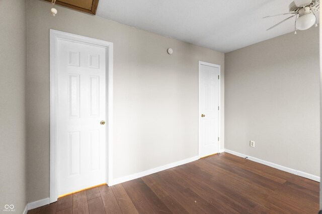 5713 Bluff Rd, Indianapolis, IN 46217 - empty room with ceiling fan, baseboards, and dark wood-style floors