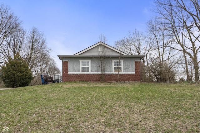 5713 Bluff Rd, Indianapolis, IN 46217 - view of home's exterior featuring a yard and brick siding