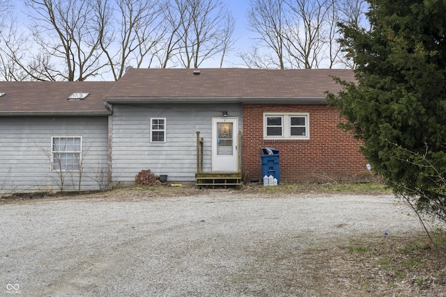 5713 Bluff Rd, Indianapolis, IN 46217 - back of house featuring entry steps and a shingled roof