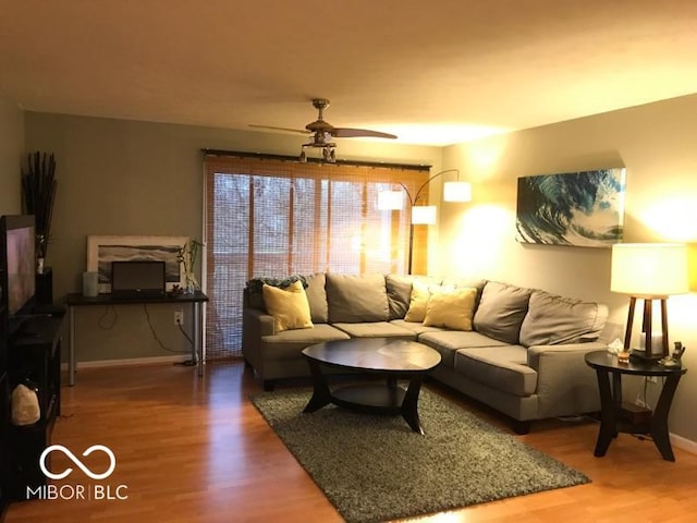 6525 Emerald Hill Ct Unit 208, Indianapolis, IN 46237 - living area featuring wood finished floors, a ceiling fan, and baseboards