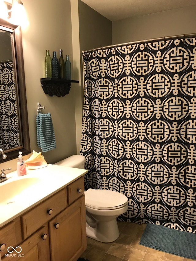 6525 Emerald Hill Ct Unit 208, Indianapolis, IN 46237 - full bathroom with tile patterned floors, vanity, and toilet