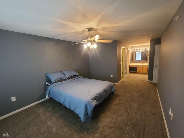 6525 Emerald Hill Ct Unit 208, Indianapolis, IN 46237 - carpeted bedroom featuring a ceiling fan, baseboards, and connected bathroom