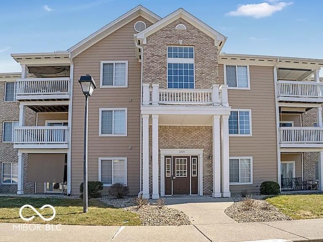 6525 Emerald Hill Ct Unit 208, Indianapolis, IN 46237 - exterior space with brick siding and a balcony