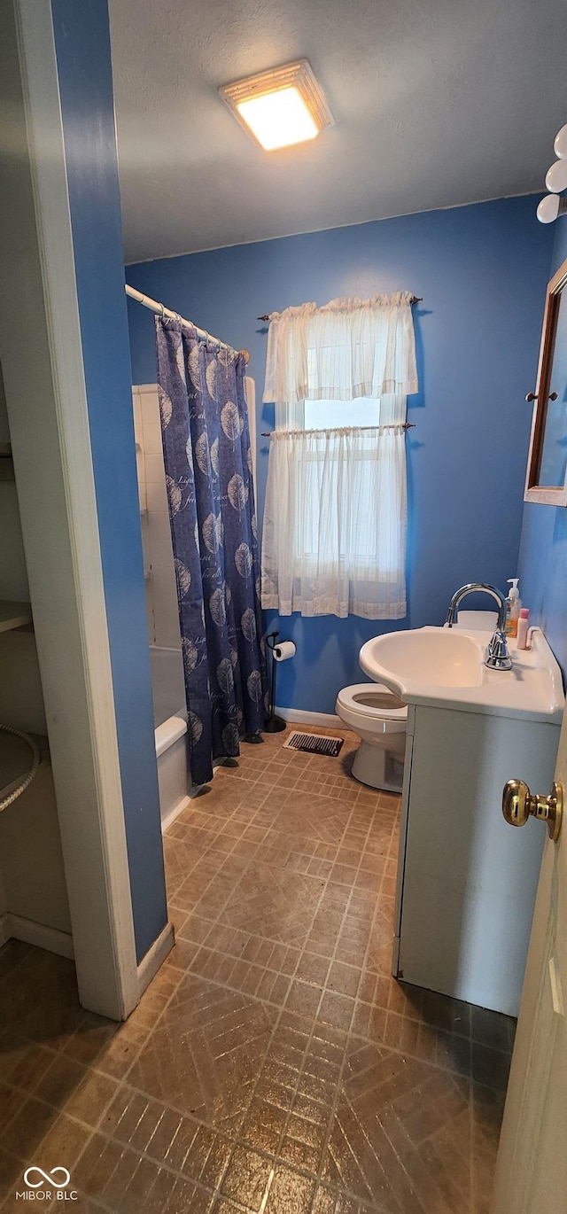 403 S Mill St, Veedersburg, IN 47987 - full bathroom with visible vents, toilet, curtained shower, and vanity