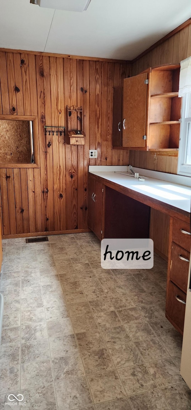 403 S Mill St, Veedersburg, IN 47987 - kitchen with wooden walls, light countertops, brown cabinetry, and open shelves