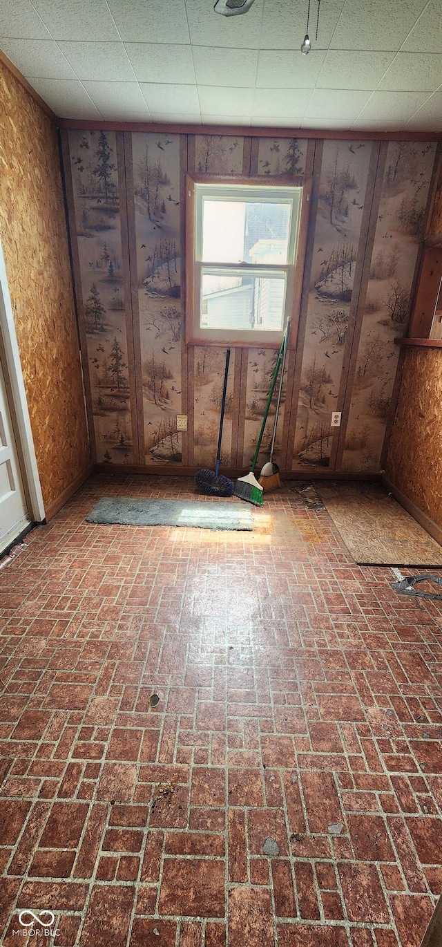 403 S Mill St, Veedersburg, IN 47987 - spare room with brick floor