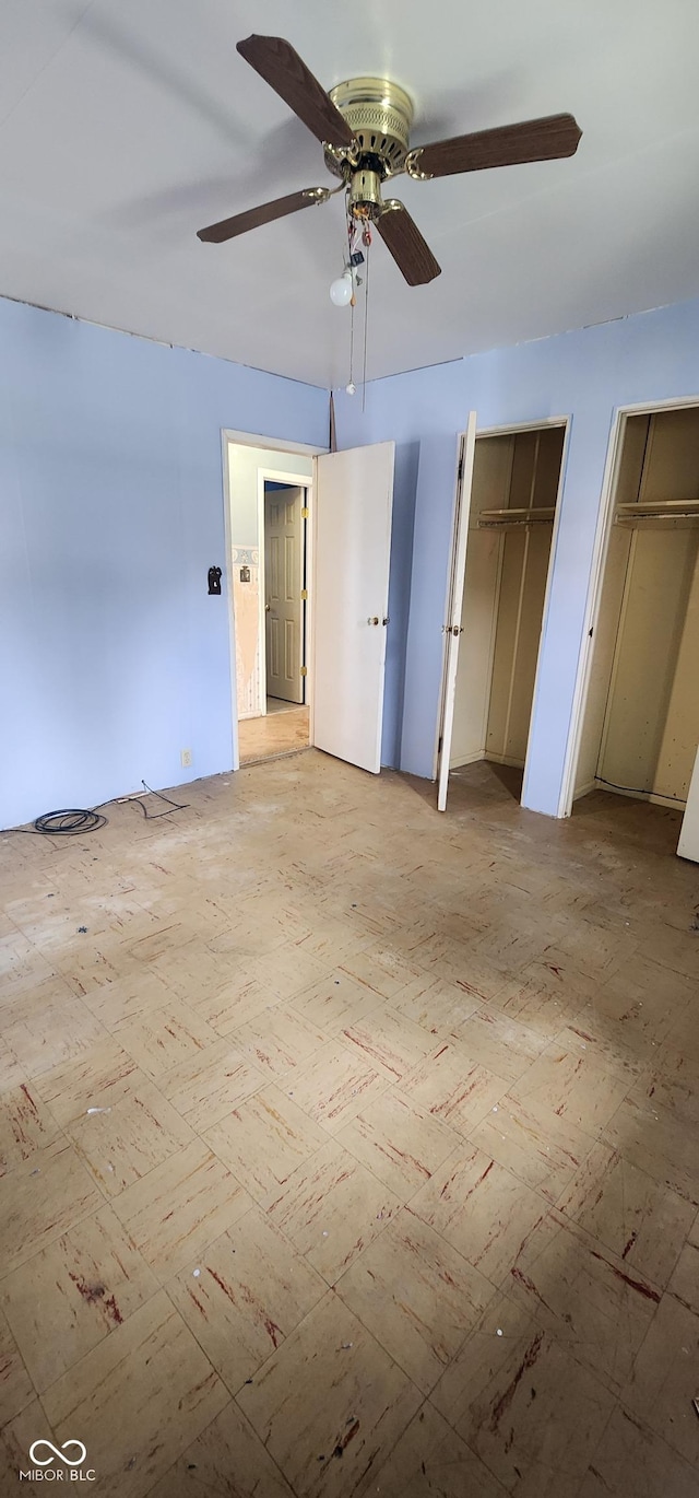 403 S Mill St, Veedersburg, IN 47987 - unfurnished bedroom featuring two closets and ceiling fan