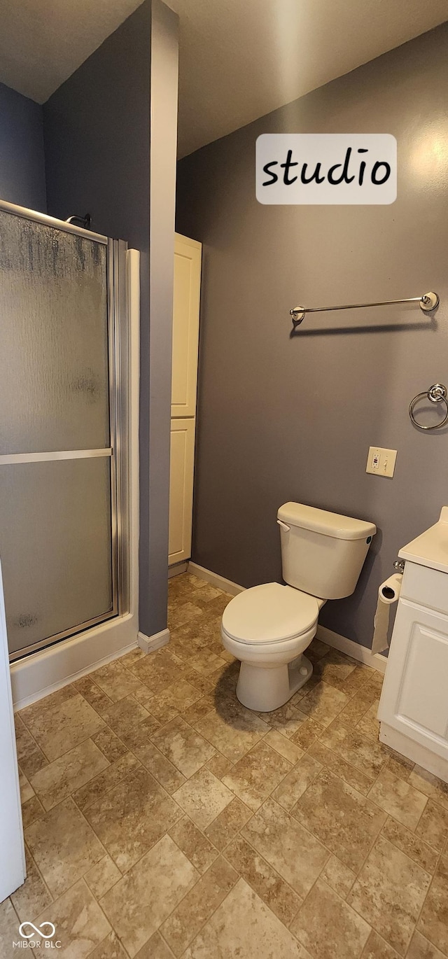 403 S Mill St, Veedersburg, IN 47987 - full bathroom with a shower stall, toilet, baseboards, and stone finish flooring