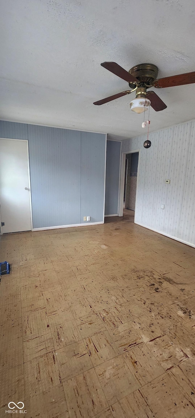 403 S Mill St, Veedersburg, IN 47987 - unfurnished room featuring tile patterned floors, a ceiling fan, baseboards, and a textured ceiling