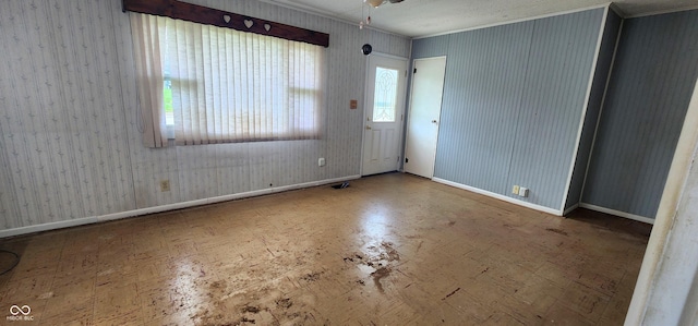 403 S Mill St, Veedersburg, IN 47987 - spare room featuring baseboards, ornamental molding, and a ceiling fan