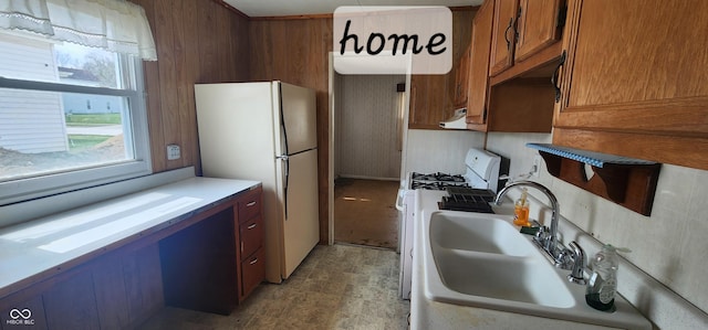 403 S Mill St, Veedersburg, IN 47987 - kitchen with a sink, wood walls, white appliances, and extractor fan