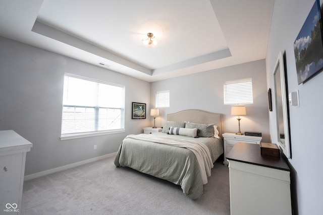 1534 Cloverdon Dr, Westfield, IN 46074 - carpeted bedroom with multiple windows, a tray ceiling, and baseboards