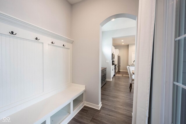 1534 Cloverdon Dr, Westfield, IN 46074 - mudroom featuring arched walkways, baseboards, and dark wood finished floors