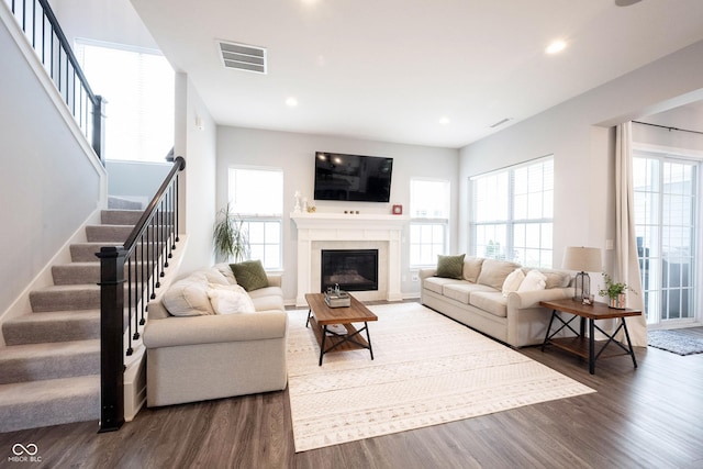 1534 Cloverdon Dr, Westfield, IN 46074 - living area featuring stairway, wood finished floors, recessed lighting, and a fireplace with flush hearth