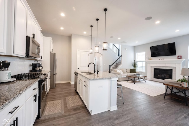 1534 Cloverdon Dr, Westfield, IN 46074 - kitchen featuring stainless steel appliances, a sink, dark wood-style flooring, white cabinets, and recessed lighting