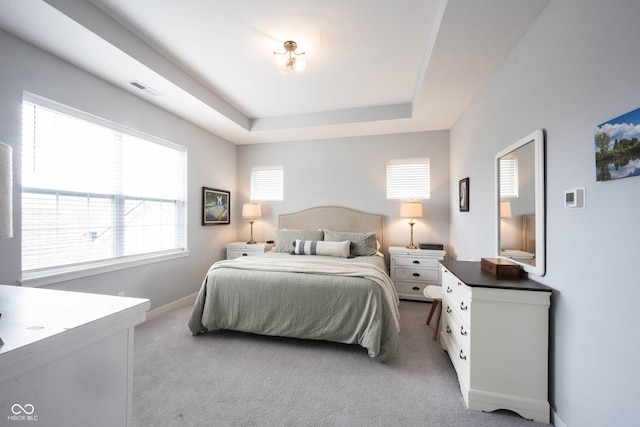 1534 Cloverdon Dr, Westfield, IN 46074 - bedroom featuring multiple windows, carpet floors, a raised ceiling, and baseboards