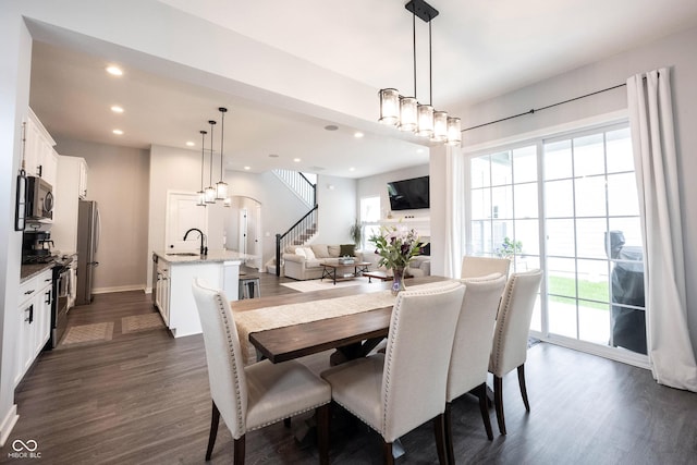 1534 Cloverdon Dr, Westfield, IN 46074 - dining room featuring dark wood-style flooring, stairs, recessed lighting, and baseboards