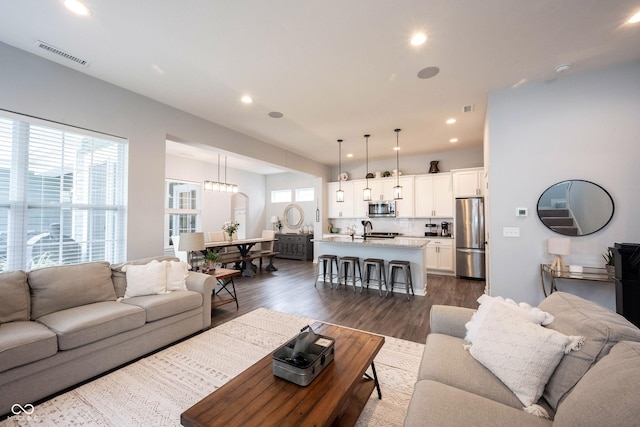1534 Cloverdon Dr, Westfield, IN 46074 - living area with dark wood-style flooring and recessed lighting