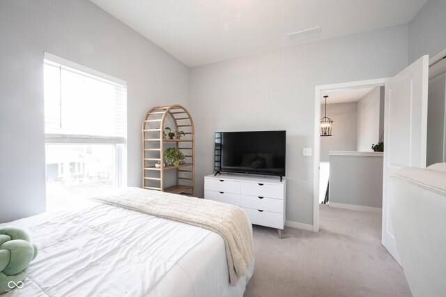 1534 Cloverdon Dr, Westfield, IN 46074 - bedroom with light colored carpet, baseboards, and a chandelier