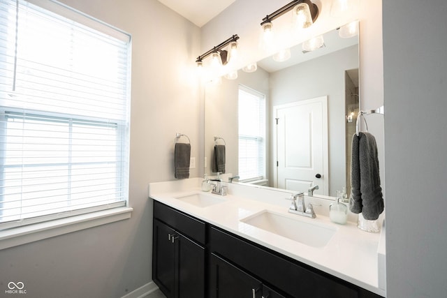 1534 Cloverdon Dr, Westfield, IN 46074 - bathroom featuring double vanity and baseboards