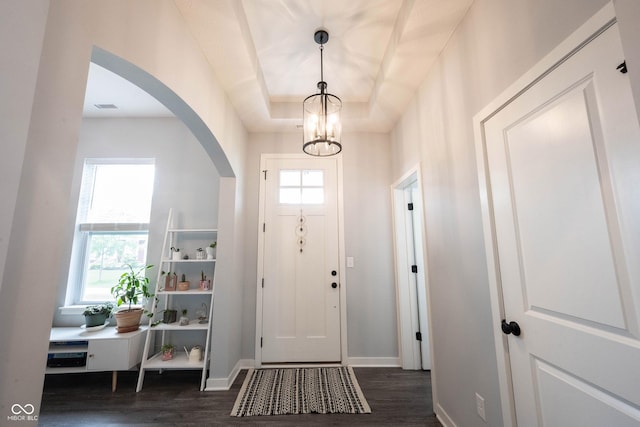 1534 Cloverdon Dr, Westfield, IN 46074 - entryway featuring dark wood-type flooring, arched walkways, baseboards, and a chandelier
