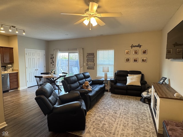 914 Baden Manor Dr, Indianapolis, IN 46217 - living room with a ceiling fan, dark wood-style floors, a textured ceiling, and baseboards