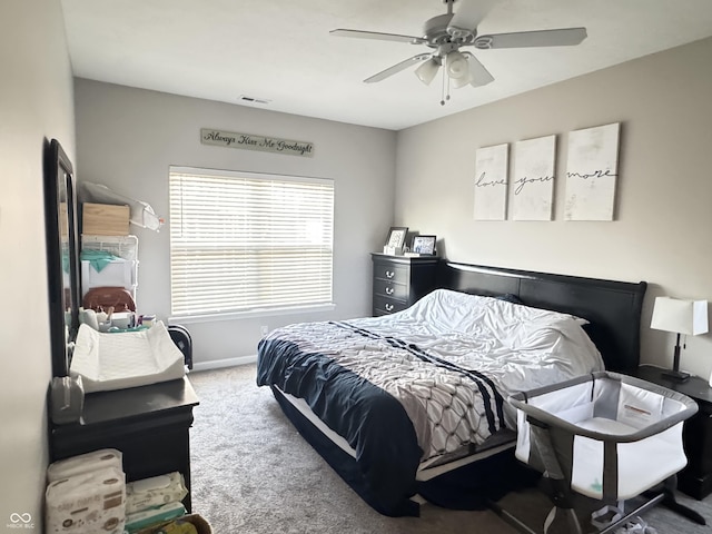 914 Baden Manor Dr, Indianapolis, IN 46217 - bedroom featuring carpet, a ceiling fan, and baseboards