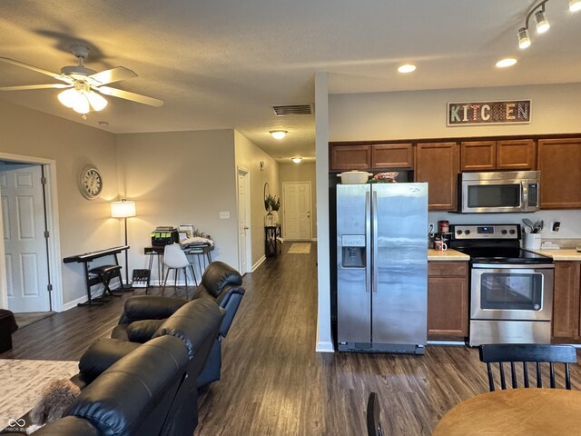 914 Baden Manor Dr, Indianapolis, IN 46217 - kitchen with stainless steel appliances, dark wood-style floors, a ceiling fan, and recessed lighting