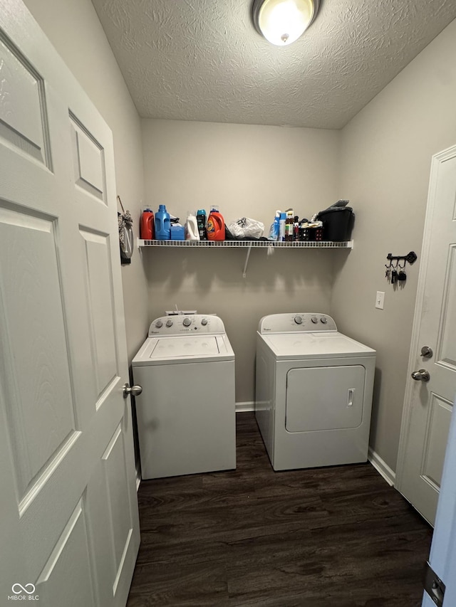 914 Baden Manor Dr, Indianapolis, IN 46217 - washroom featuring independent washer and dryer, dark wood-type flooring, a textured ceiling, and baseboards