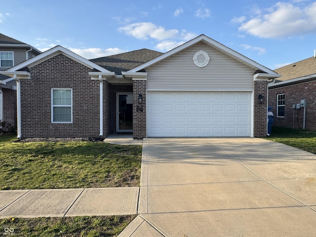 914 Baden Manor Dr, Indianapolis, IN 46217 - view of front of house featuring brick siding, driveway, an attached garage, and a front yard