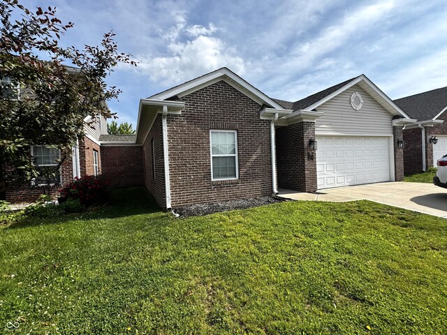 914 Baden Manor Dr, Indianapolis, IN 46217 - view of front of house featuring brick siding, concrete driveway, a garage, and a front lawn