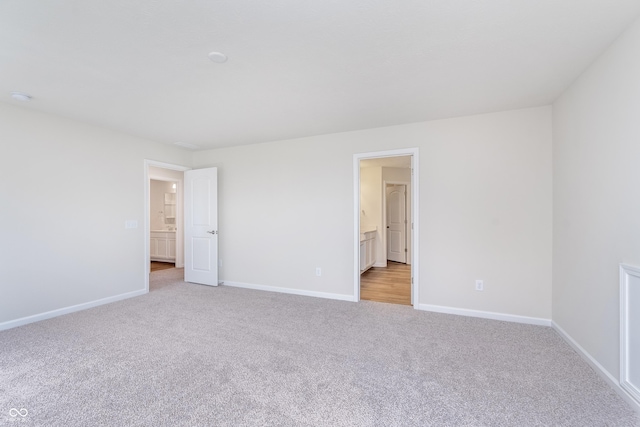 2741 Penn Ave, Plainfield, IN 46168 - unfurnished bedroom featuring light carpet and ensuite bath