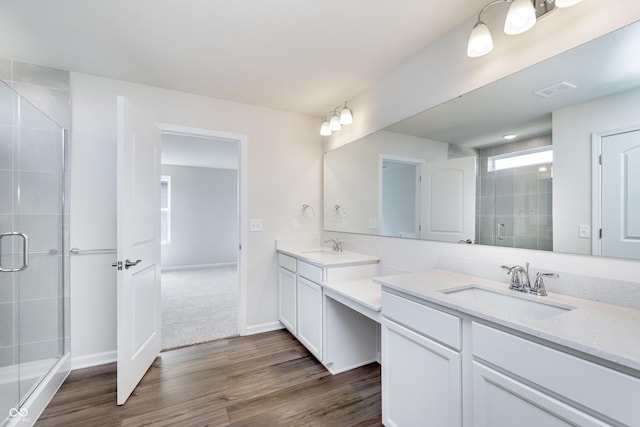 2741 Penn Ave, Plainfield, IN 46168 - full bath featuring vanity, a shower stall, and wood finished floors