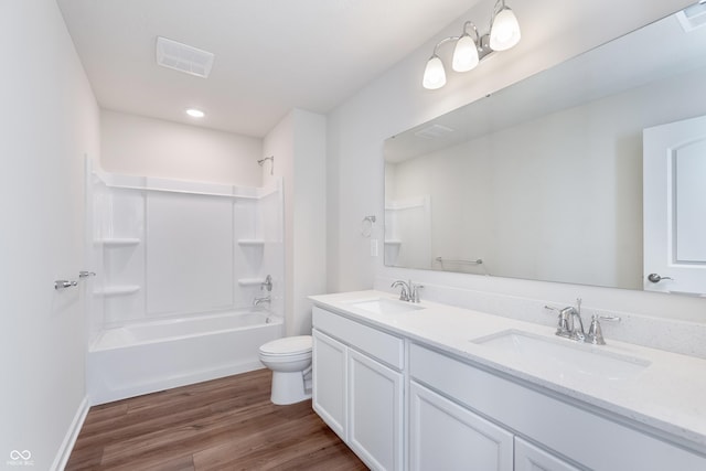 2741 Penn Ave, Plainfield, IN 46168 - full bathroom featuring double vanity, shower / bath combination, wood finished floors, and recessed lighting