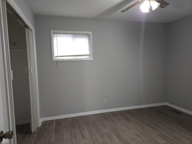 1931 Brentwood Dr, Anderson, IN 46011 - unfurnished bedroom with wood finished floors, a closet, a ceiling fan, and baseboards