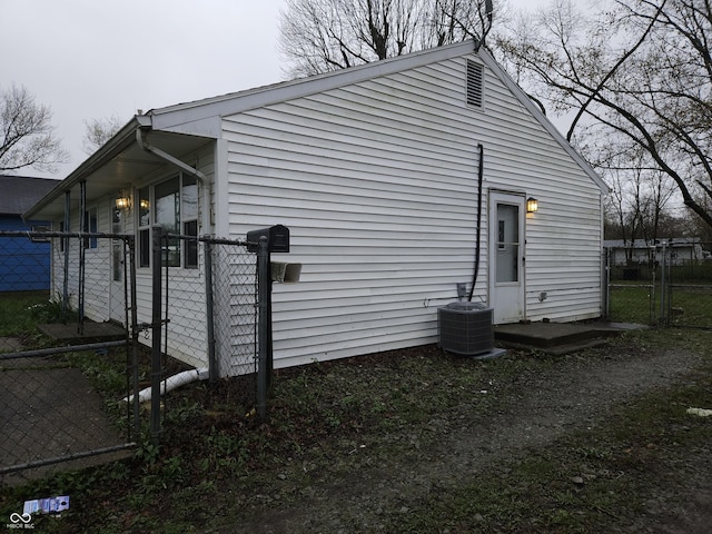1931 Brentwood Dr, Anderson, IN 46011 - view of side of property featuring cooling unit, fence, and a gate