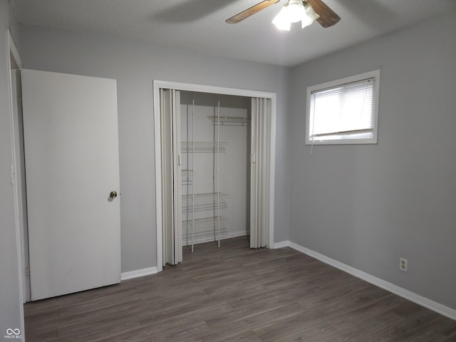 1931 Brentwood Dr, Anderson, IN 46011 - unfurnished bedroom with ceiling fan, a closet, baseboards, and wood finished floors