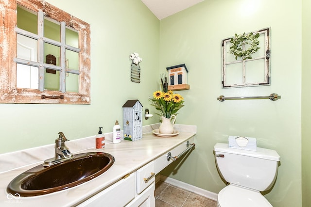 1153 Diablo Rd, Greenwood, IN 46143 - bathroom with toilet, tile patterned floors, vanity, and baseboards