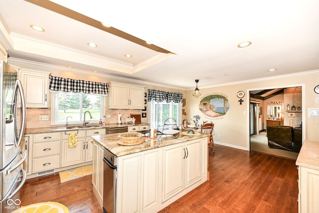 1153 Diablo Rd, Greenwood, IN 46143 - kitchen featuring stainless steel fridge, a sink, ornamental molding, wood finished floors, and a kitchen island