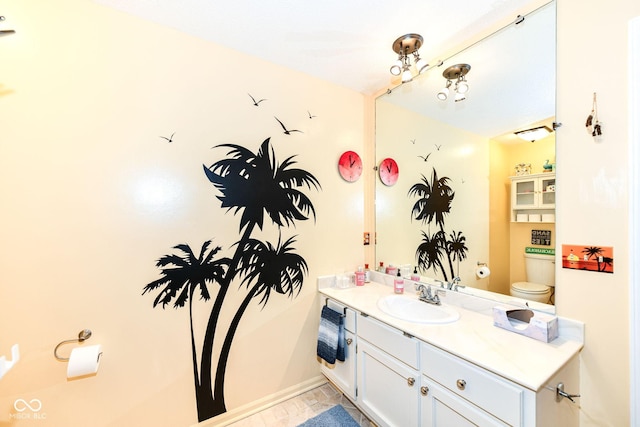 1153 Diablo Rd, Greenwood, IN 46143 - bathroom with toilet, vanity, and baseboards