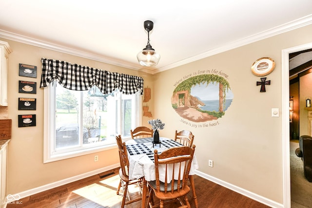 1153 Diablo Rd, Greenwood, IN 46143 - dining space featuring crown molding, visible vents, baseboards, and dark wood finished floors