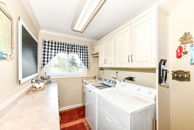 1153 Diablo Rd, Greenwood, IN 46143 - washroom featuring baseboards, ornamental molding, washing machine and clothes dryer, cabinet space, and a sink