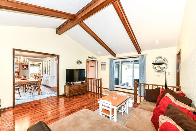 1153 Diablo Rd, Greenwood, IN 46143 - living room with an inviting chandelier, wood finished floors, and lofted ceiling with beams