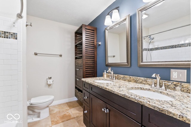 10129 Guilford Ave, Carmel, IN 46280 - bathroom with toilet, double vanity, a sink, and tiled shower