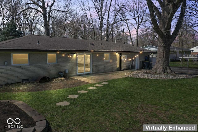 10129 Guilford Ave, Carmel, IN 46280 - rear view of property with crawl space, brick siding, fence, and a lawn