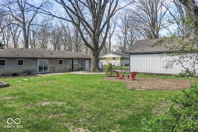 10129 Guilford Ave, Carmel, IN 46280 - view of yard with an outdoor fire pit, a patio, and fence