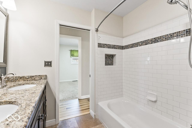 10129 Guilford Ave, Carmel, IN 46280 - full bathroom featuring tub / shower combination, double vanity, a sink, and baseboards